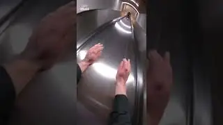 Daredevils slide down three flights of escalators