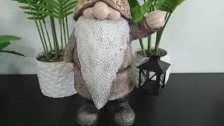 A gnome ornament with a solar lamp