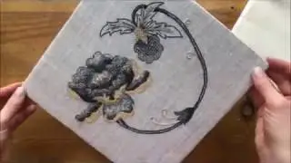 The SF School of Needlework and Design demonstrates adding a backing to a  laced embroidery.