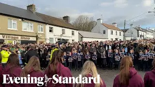 Huge crowds line the street for Ashling Murphy's funeral