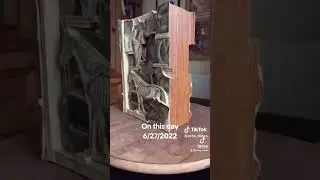 Book Carving/ free standing sculpture, made from large old animal stock book.