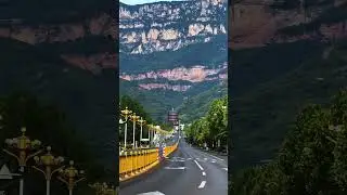 The road is the Red Flag Canal Avenue, the city is Linzhou City, Mountain is the Taihang Mountains.