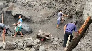 manual mining activities digging sand and collecting stones