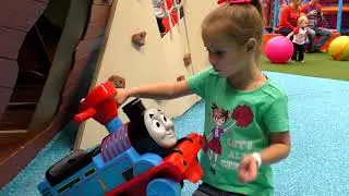 Sofia Fun playing on Playground for children with Thomas Train.
