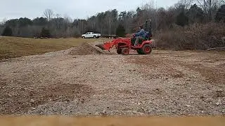 Moving gravel with Kubota bx2370 and the heavy hitch tooth bar.