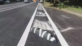 St. Louis using zebra-style delineators to help separate car and bike traffic
