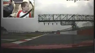 Evan being driven round Silverstone circuit by driver Tom Blomqvist on the 26th July 2011