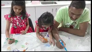 Hariya & Yahrah Colouring A Xmas Tablecloth