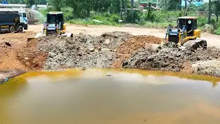 Nice Equipment Operator Filling Pond Heavy Dump Truck Unloading Dirt, Dozer Pushing Dirt
