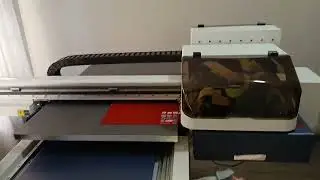 F2-6090UV: Flatbed UV Printer, Printing cartoon characters directly onto acrylic sheet.