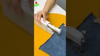 A small handheld electric sewing machine