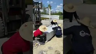 Installation process for a curved translucent concrete sitting bench in a park