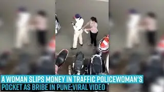 A woman slips money in traffic policewoman's pocket as bribe in Pune.