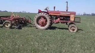 Discing ground with a Farmall 560