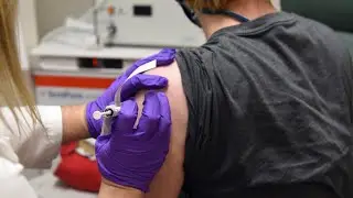Feeling unwell after a COVID vaccine shot? Experts say that's a good thing