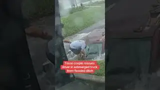 Texas couple rescues driver in submerged truck from flooded ditch #shorts