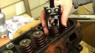 Replacing valve stem seal with overhead spring compressor