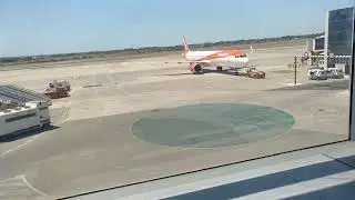 Alicante Airport Exploration: Busy Terminals, Book Discoveries, and Thoughts on Protests