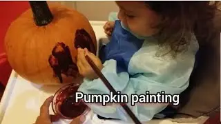 My 2 yrs. old son is painting the pumpkin. Painting time.