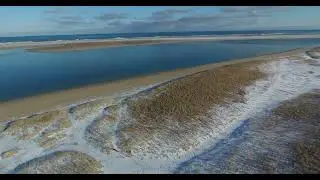 Snowy Lighthouse Beach at Chatham, Cape Cod Flyover Stock Footage #65D