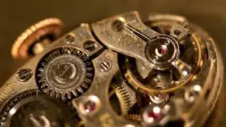 VideoVault Stock Video: Luxury automatic watch movement of an old pocket watch made of gold