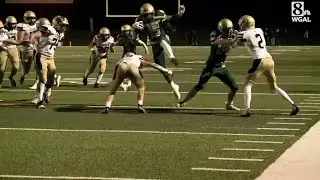 York Catholic's Levan McFadden hurdles a defender