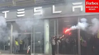 RAW VIDEO: Protestors Demonstrate Inside Paris, France, Tesla Dealership