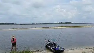 My wife fishing the Tomoka River/Tomoka Basin. Jon Boat beached. Enjoying the day.