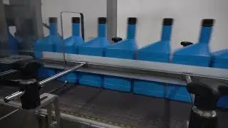 Combi's DPI Drop Packer | Efficiently Case Packing Bottles of Automotive Oil