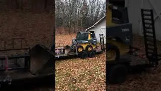John Deere 318D On The New Equipment Trailer. New Salt Dogg 2 yd Spreader