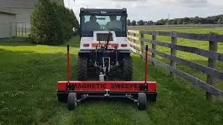 Tow behind Magnetic Sweeper Attached to Bobcat