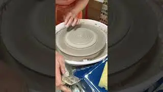 Throwing a spoon rest on a pottery wheel, using a hand made texture tool