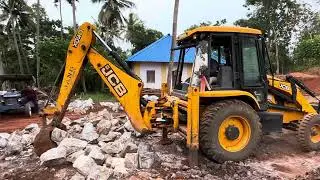 Jcb 3dx moving and gathering rock pieces