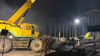 the process by which a crane prepares to lift a very heavy object