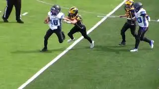 Westland Meteors freshman's Aidan Stanfield brings down Canton Lions QB #18, Fowler for 2 yard loss