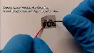 Direct Laser Writing for Creating Metal Electrodes for Paper Electronics