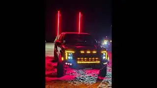 F150 Raptor R Buggy Whips Red at night with Rigid Rock lights red