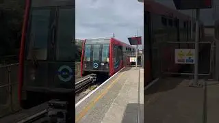 DLR B07 104 departing Canning Town