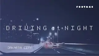 Driving at night in Jakarta city looking at buildings