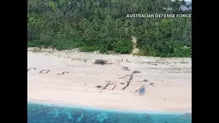 Sailors rescued thanks to giant SOS sign written in the sand