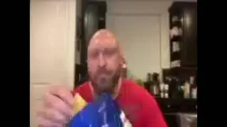 bald dude eating chips low quality