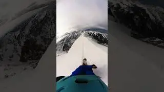 Snowboarding cliff backcountry edge of the world