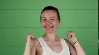 Excited red haired woman smiling showing thumbs up