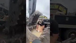 Seeding 8 acres mixing seed in excavator bucket