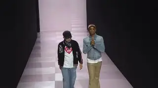 Pharrell Williams of Louis Vuitton and Nigo of Kenzo on catwalk after collab show