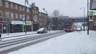 Bus in the snow at Ruislip Manor station