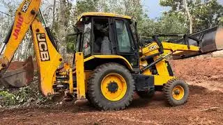 Jcb 3dx digging soil and levelling land for starting construction work 