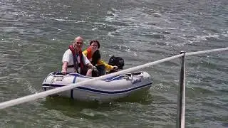 My dad teaching my daughter how to use the dingy as she wanted to learn