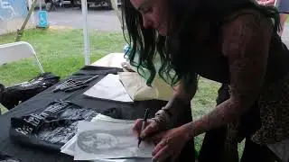 Sarah Anthony of The Letter Black signing my friend Rachel's drawing