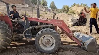 rural house.The loader smoothed the area around the feather house and this made the children happy